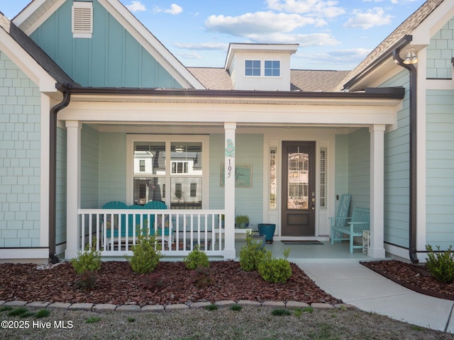 105 Camden Trl, Hampstead, NC 28443 - entrance to property featuring covered porch and board and batten siding