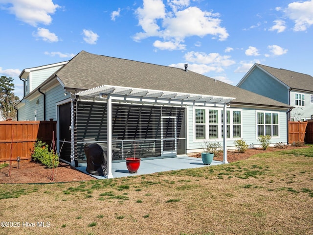 105 Camden Trl, Hampstead, NC 28443 - back of property with a pergola, a patio area, and roof with shingles