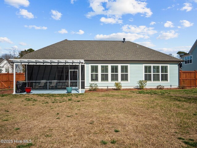 105 Camden Trl, Hampstead, NC 28443 - back of house featuring a pergola and roof with shingles