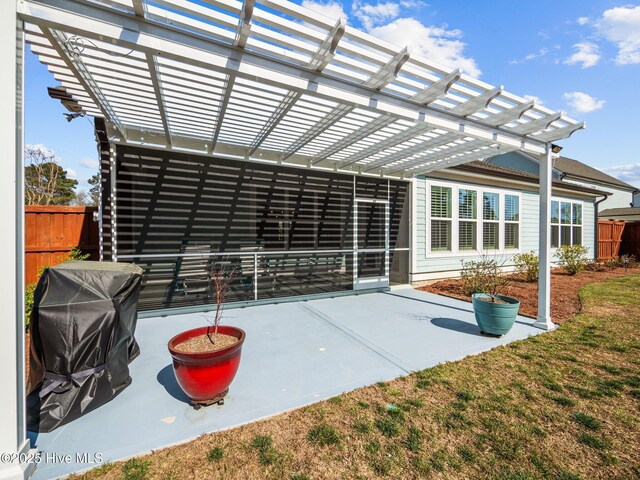 105 Camden Trl, Hampstead, NC 28443 - rear view of property featuring a pergola and a patio area