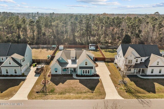 105 Camden Trl, Hampstead, NC 28443 - aerial perspective of suburban area featuring a heavily wooded area