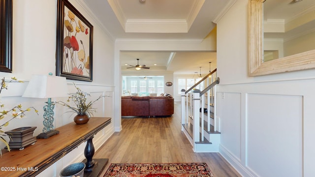 105 Camden Trl, Hampstead, NC 28443 - entrance foyer with wood finished floors, a raised ceiling, stairs, ornamental molding, and ceiling fan
