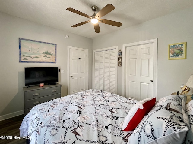 bedroom featuring baseboards, a ceiling fan, a closet, and dark wood-style floors