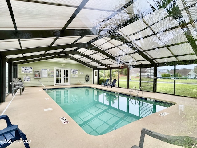 community pool with a lanai, a patio, and french doors