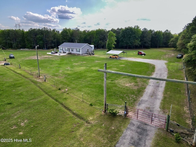 aerial view featuring a rural view and a wooded view
