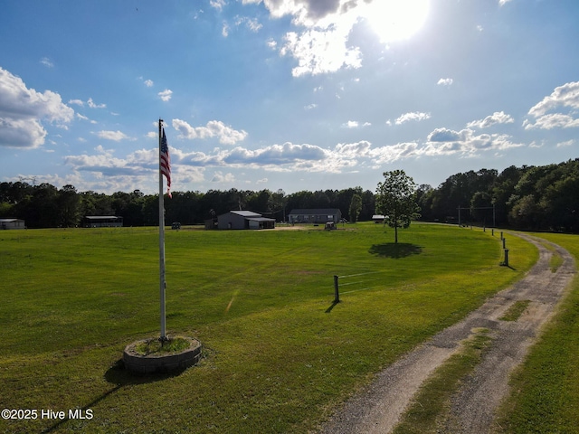 view of property's community with a lawn
