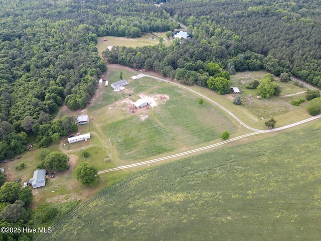 aerial view featuring a rural view and a view of trees