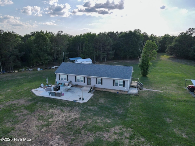 drone / aerial view featuring a view of trees