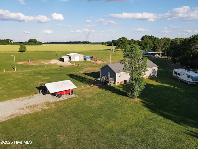 birds eye view of property featuring a rural view