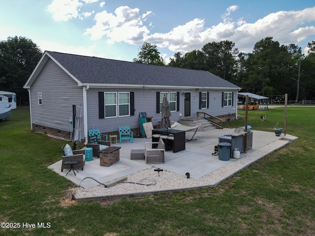 back of house with a lawn, a patio area, a shingled roof, and crawl space