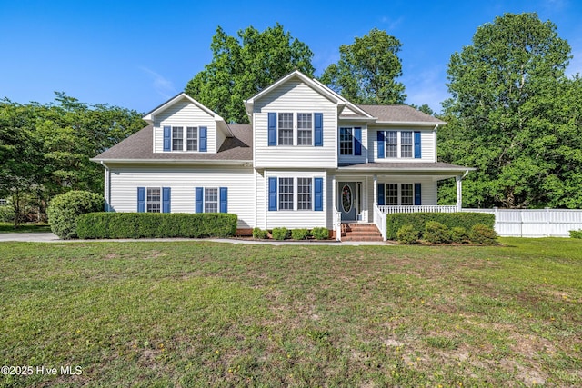 view of front of house with covered porch and a shingled roof