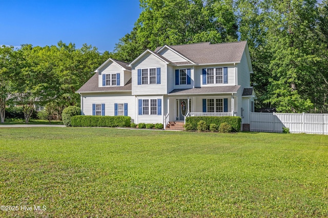 view of front of home with covered porch and a shingled roof