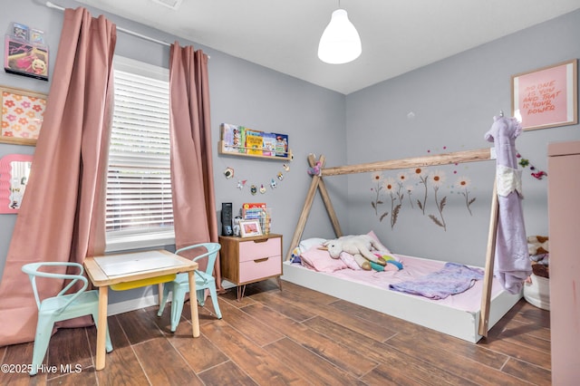 bedroom with wood finished floors