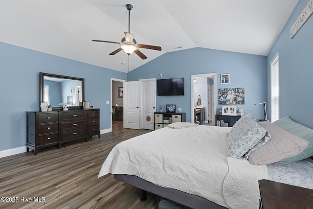 bedroom with baseboards, visible vents, wood finished floors, and lofted ceiling