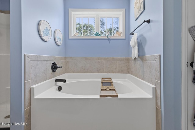 bathroom with a garden tub