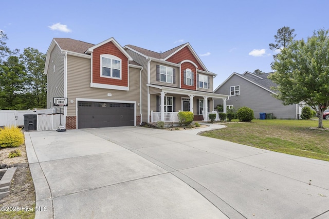 view of front of house featuring covered porch, driveway, a gate, a garage, and a front lawn