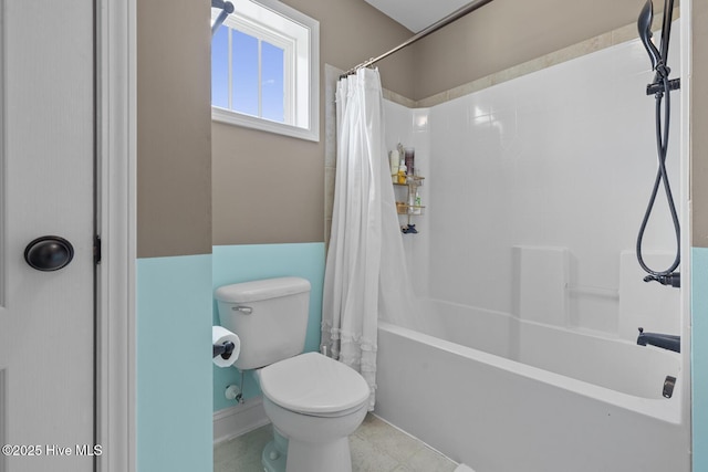 bathroom with toilet and shower / tub combo with curtain