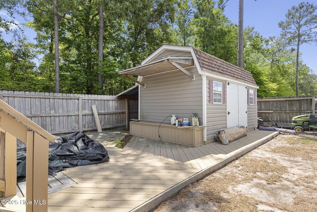 view of shed with a fenced backyard