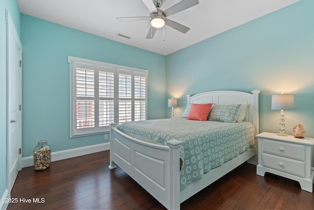 bedroom featuring dark wood finished floors, baseboards, and ceiling fan