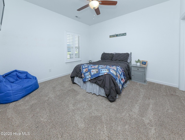 carpeted bedroom with baseboards and ceiling fan