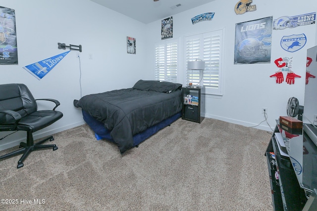 carpeted bedroom with baseboards