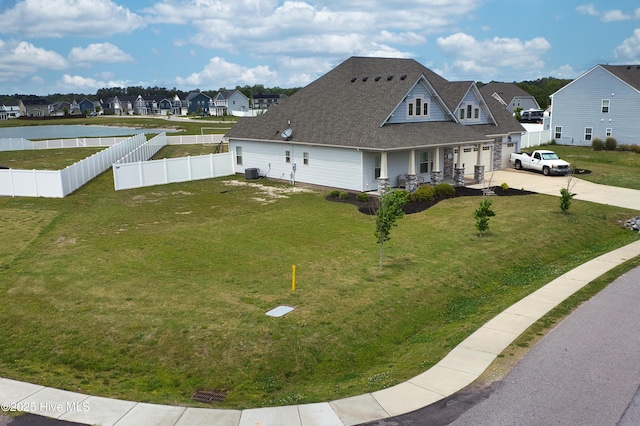 view of home's exterior featuring covered porch, a residential view, concrete driveway, a garage, and a shingled roof