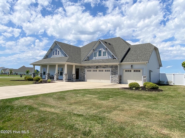 craftsman house with a porch, a garage, concrete driveway, stone siding, and roof with shingles