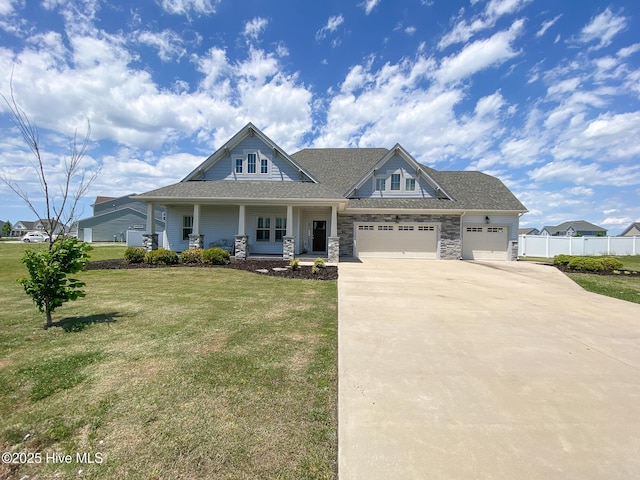 craftsman house featuring concrete driveway, a garage, covered porch, stone siding, and roof with shingles