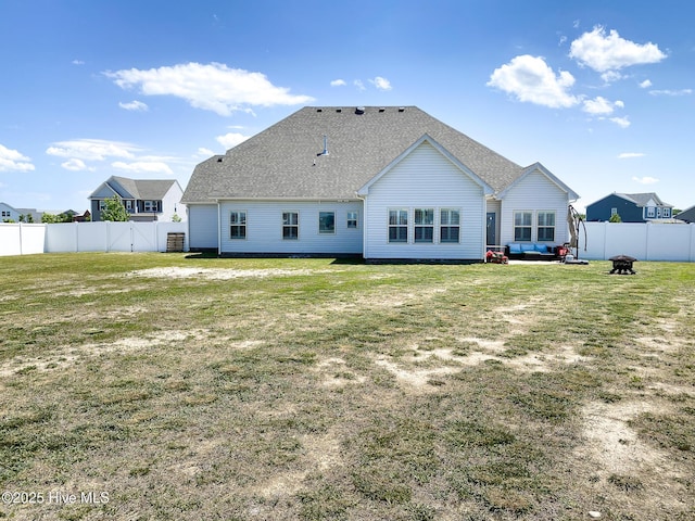 back of property featuring a fire pit