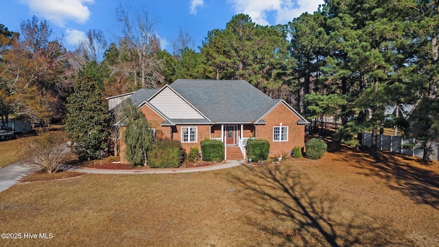117 Quail Woods Dr, New Bern, NC 28560 - ranch-style home featuring brick siding, fence, and a front yard