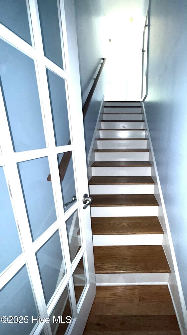 117 Quail Woods Dr, New Bern, NC 28560 - staircase with french doors and wood finished floors