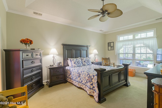 bedroom featuring multiple windows, ornamental molding, and light colored carpet