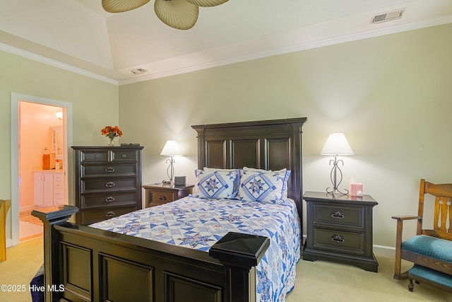 bedroom with baseboards, ornamental molding, ensuite bath, visible vents, and light colored carpet