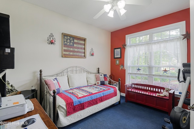 carpeted bedroom featuring ceiling fan