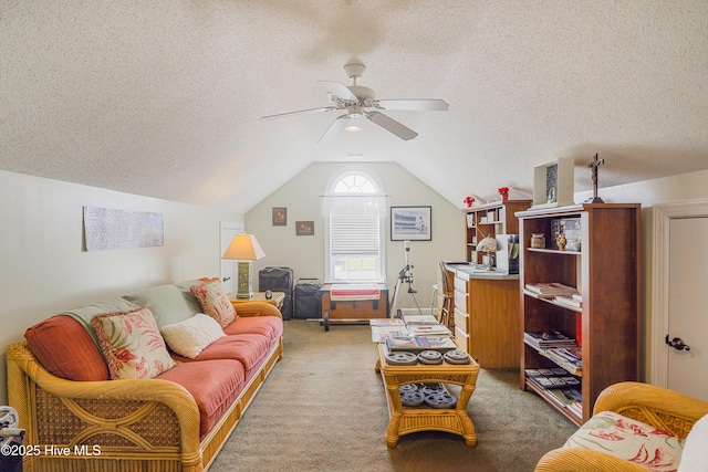 living area featuring light colored carpet, a textured ceiling, vaulted ceiling, and a ceiling fan