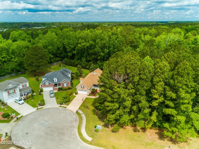 bird's eye view featuring a forest view