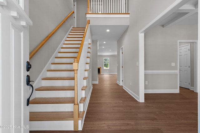 entrance foyer with wood finished floors, stairway, recessed lighting, and baseboards