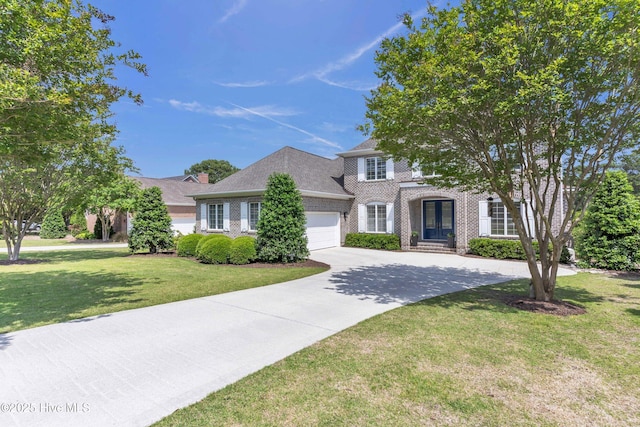view of front facade with brick siding, an attached garage, driveway, and a front yard