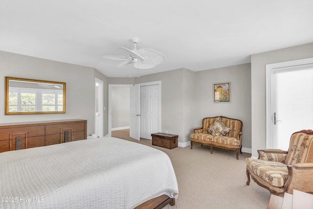 carpeted bedroom featuring ceiling fan, baseboards, and a closet