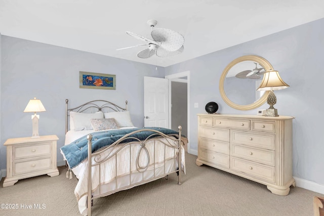 bedroom with light carpet, baseboards, and ceiling fan