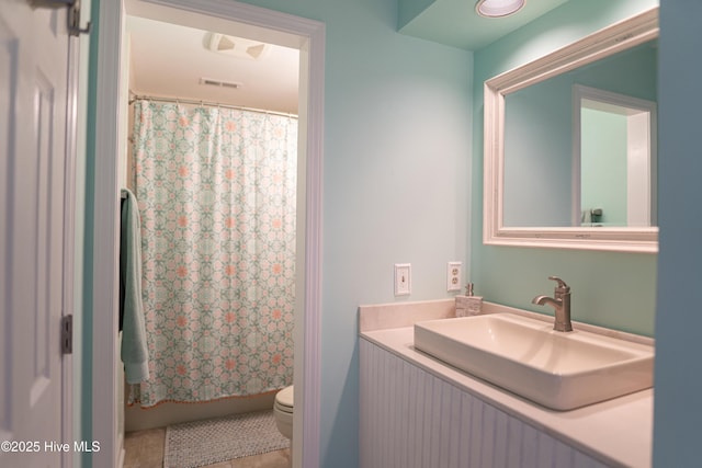 bathroom with toilet and vanity