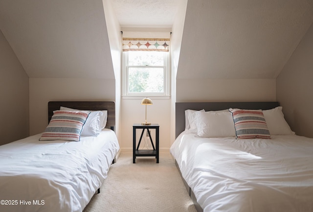 carpeted bedroom featuring lofted ceiling