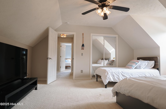 bedroom featuring vaulted ceiling, light colored carpet, a ceiling fan, and baseboards