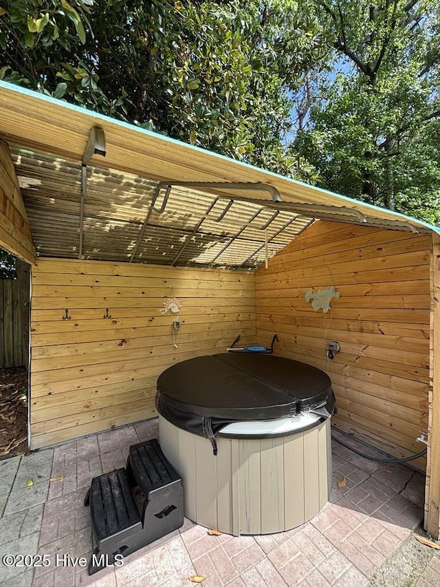 view of patio / terrace featuring a hot tub