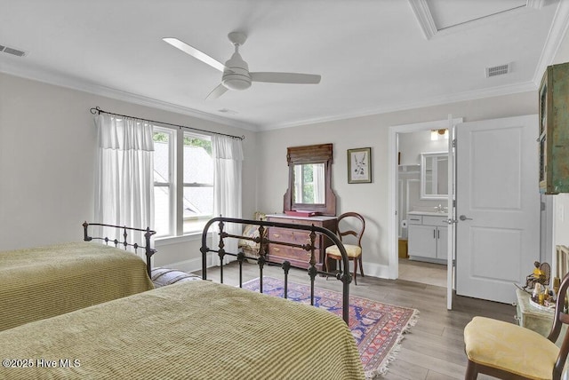 489 Broomsedge Ct SE, Bolivia, NC 28422 - bedroom featuring crown molding, wood finished floors, baseboards, a ceiling fan, and ensuite bathroom