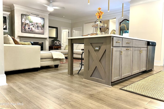 489 Broomsedge Ct SE, Bolivia, NC 28422 - living area featuring light wood-type flooring, a glass covered fireplace, ceiling fan, and crown molding