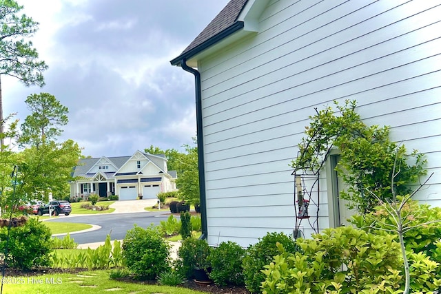 489 Broomsedge Ct SE, Bolivia, NC 28422 - view of side of property featuring a garage