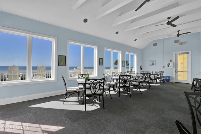 489 Broomsedge Ct SE, Bolivia, NC 28422 - dining space with ceiling fan, dark colored carpet, and baseboards