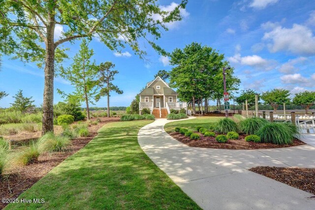 489 Broomsedge Ct SE, Bolivia, NC 28422 - view of property's community featuring a lawn