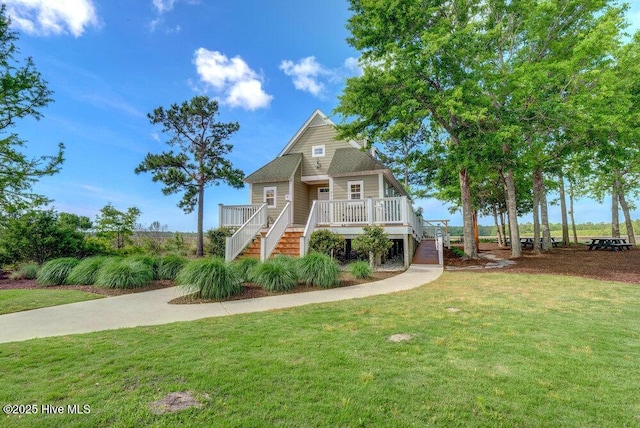 489 Broomsedge Ct SE, Bolivia, NC 28422 - view of front of home with stairway, a front yard, and a wooden deck